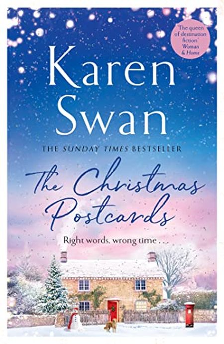 Cover of "The Christmas Postcards" by Karen Swan, featuring a snowy cottage scene with a starry sky and festive decorations.