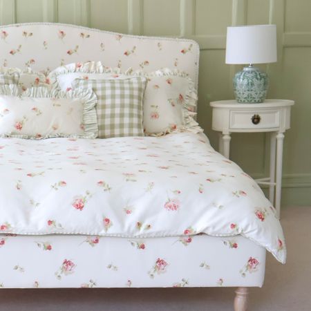 Nostalgic rose bed styled with Gustavian White oval bedside.