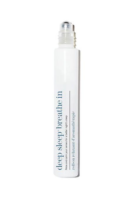 A white roll-on bottle labeled "deep sleep breathe in" with a clear cap, designed for aromatherapy use.