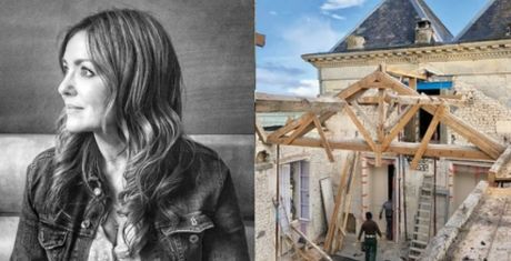 A woman in a denim jacket in a black-and-white portrait beside a construction site with wooden beams and an old building.