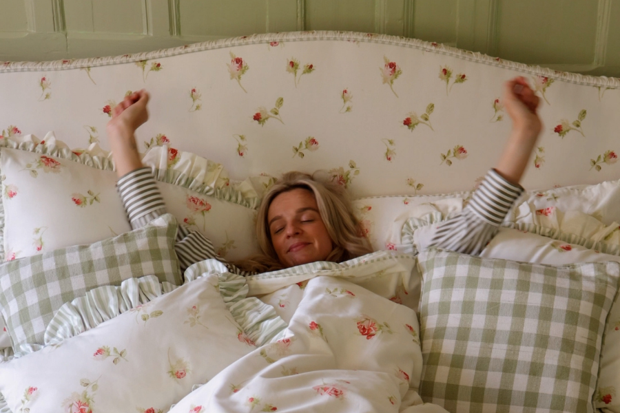 A cosy sleep sanctuary with a floral bed and matching rose print bedding.