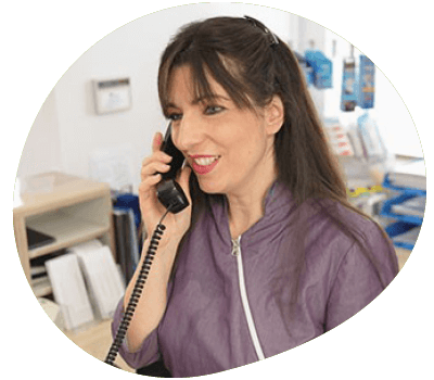 Dental practice member speaking into a telephone