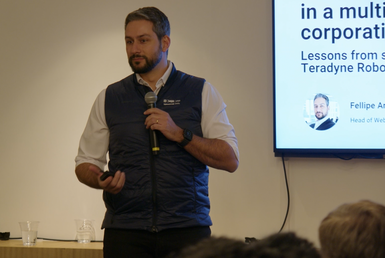 Presenter from Teradyne Robotics presenting attendees in the Franklin EastBlack in New York.