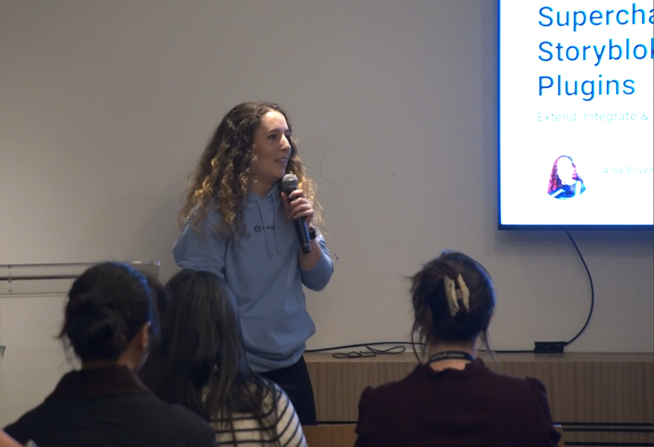 Storyblok employee Alba Silvente presents the breakout session Supercharge Storyblok with Plugins to an audience in the Black Loft room at JoyConf New York.