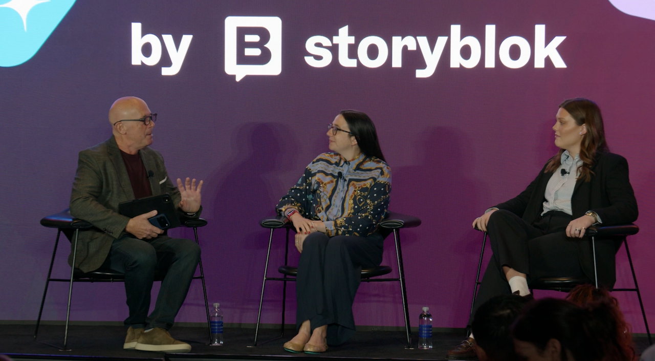MC and host Mark Jeffries interviews two journalists as part of the Journalist panel session on the main stage at JoyConf New York.
