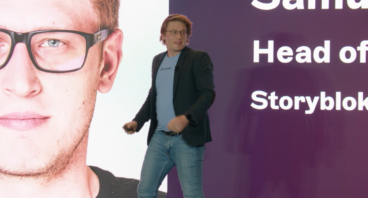 Storyblok employee Samuel Snopko presenting Storyblok Future Roadmap to attendees on the main keynote stage at JoyConf New York.