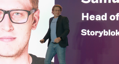 Storyblok employee Samuel Snopko presenting Storyblok Future Roadmap to attendees on the main keynote stage at JoyConf New York.