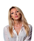 Woman with long blonde hair wearing a white blouse, looking directly at the camera against a plain background.