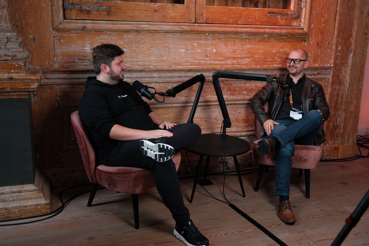 Storyblok co-founders at JoyConf Amsterdam, sitting opposite each other.