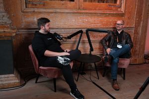 Storyblok co-founders at JoyConf Amsterdam, sitting opposite each other.