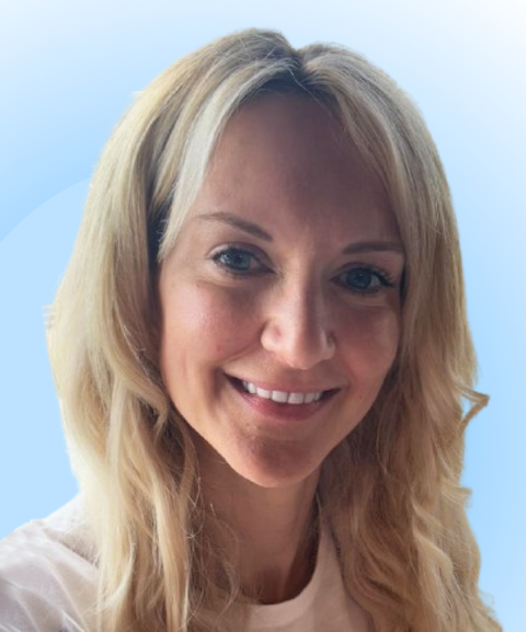 Smiling woman with long blonde hair against a light blue gradient background.