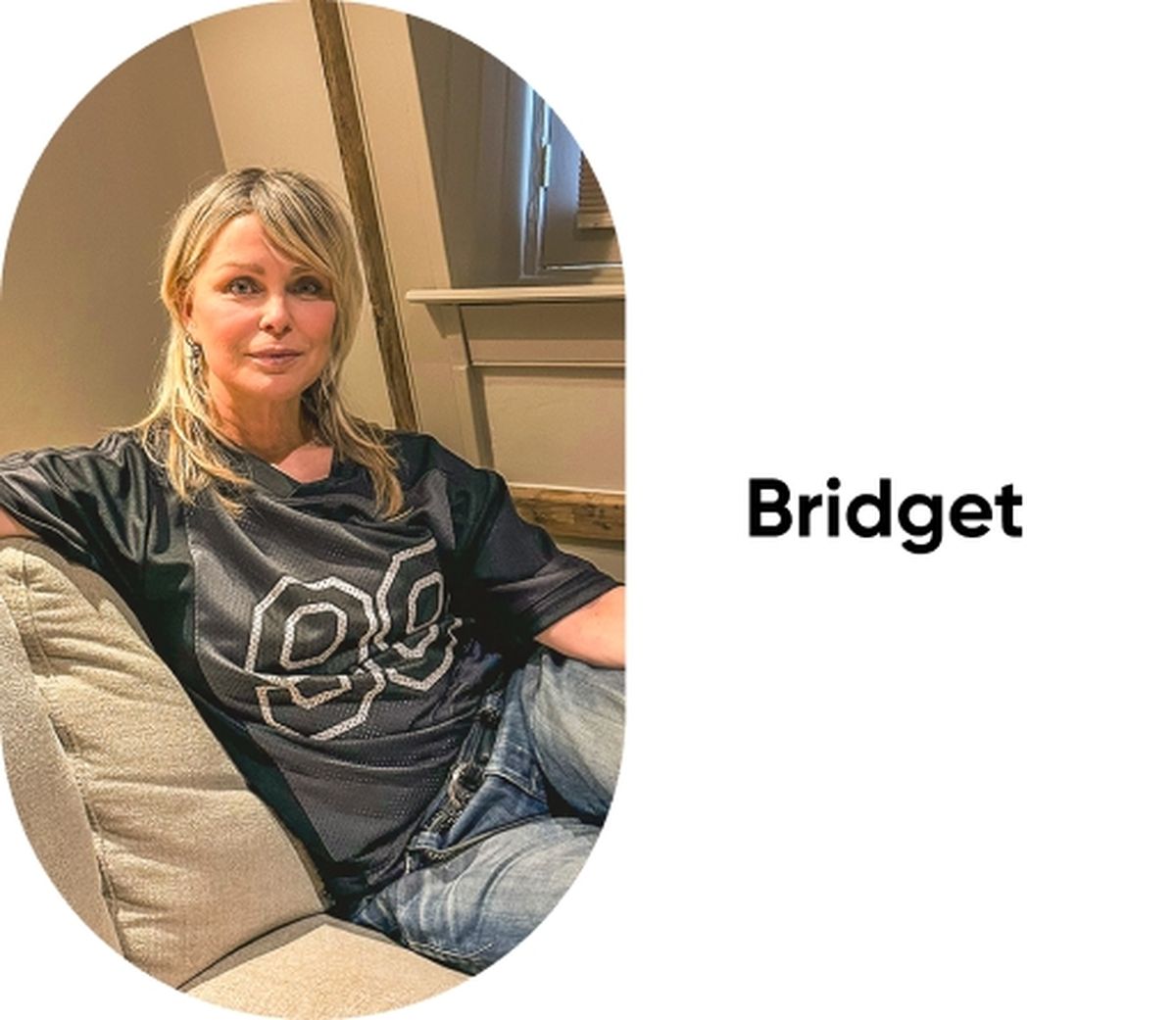 Woman with blonde hair wearing a black jersey with the number 89, sitting casually on a beige couch next to a window. Text reads "Bridget."