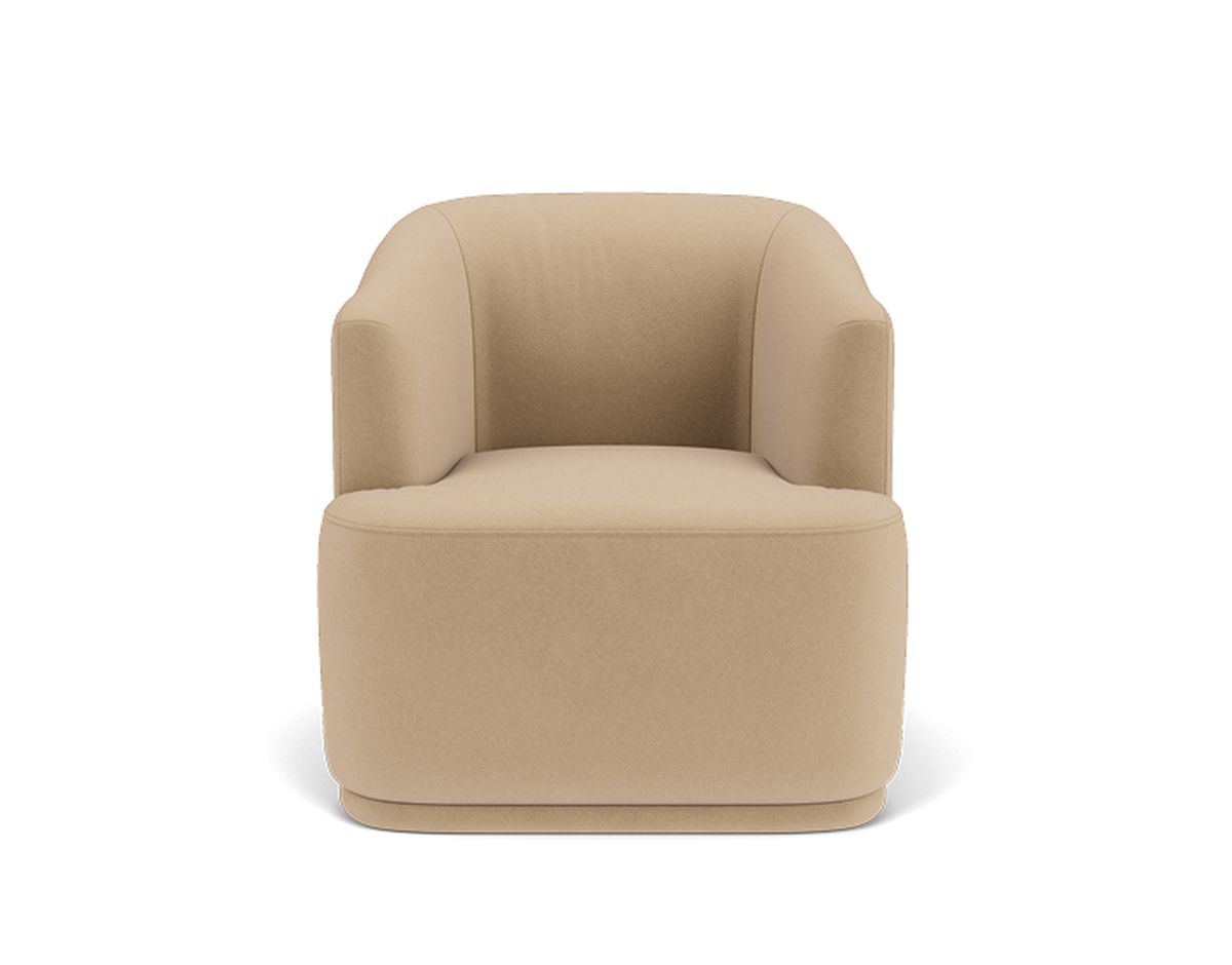 A modern tan armchair with a curved back and smooth finish, viewed from the front against a white background.