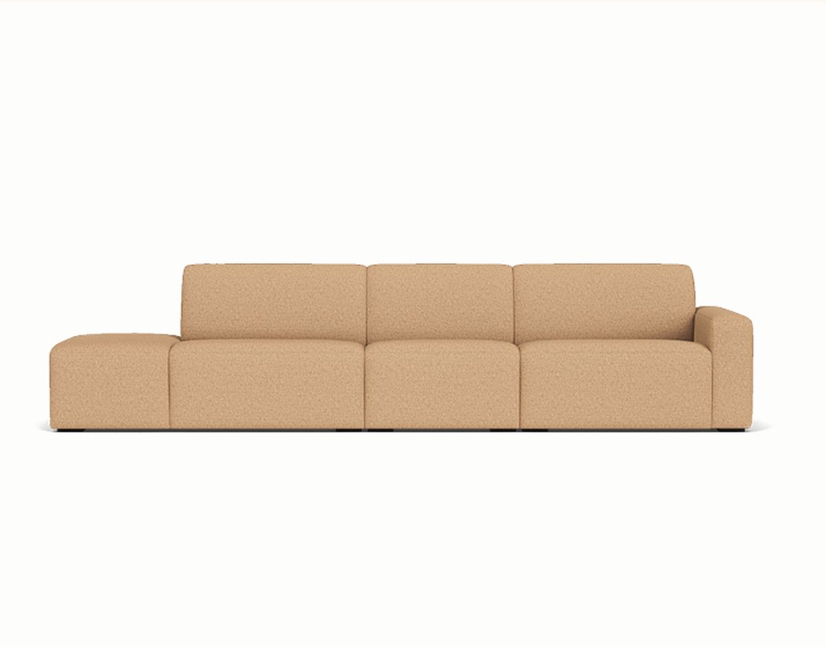A modern modular beige sofa with four sections, including a single armrest on the right, set against a plain white background.