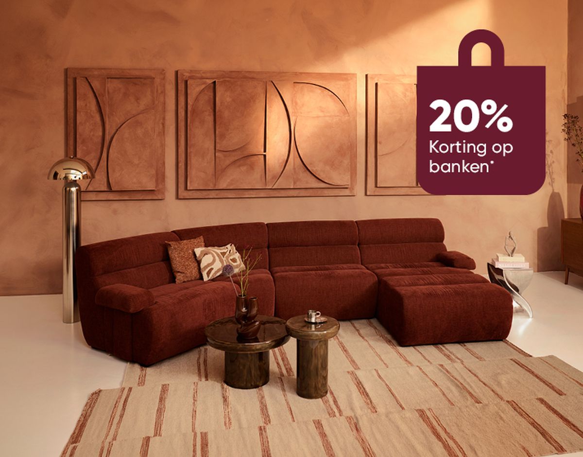 Brown L-shaped sofa with cushions in a warm, modern living room featuring abstract wall art, a floor lamp, and a discount sign reading "20% Korting op banken".