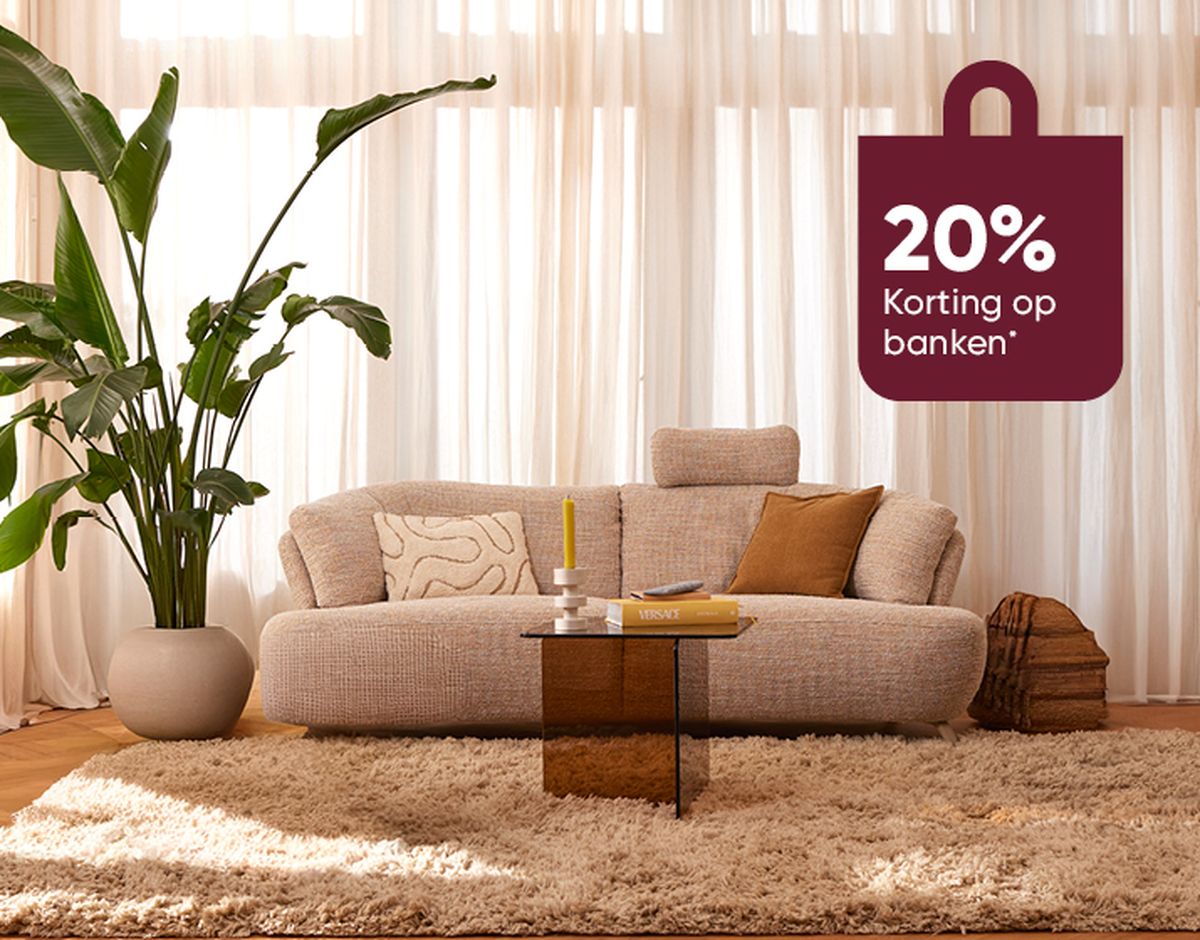 Beige sofa with cushions, wooden coffee table, large plant in a pot, light curtains, and a discount sign reading "20% Korting op banken."