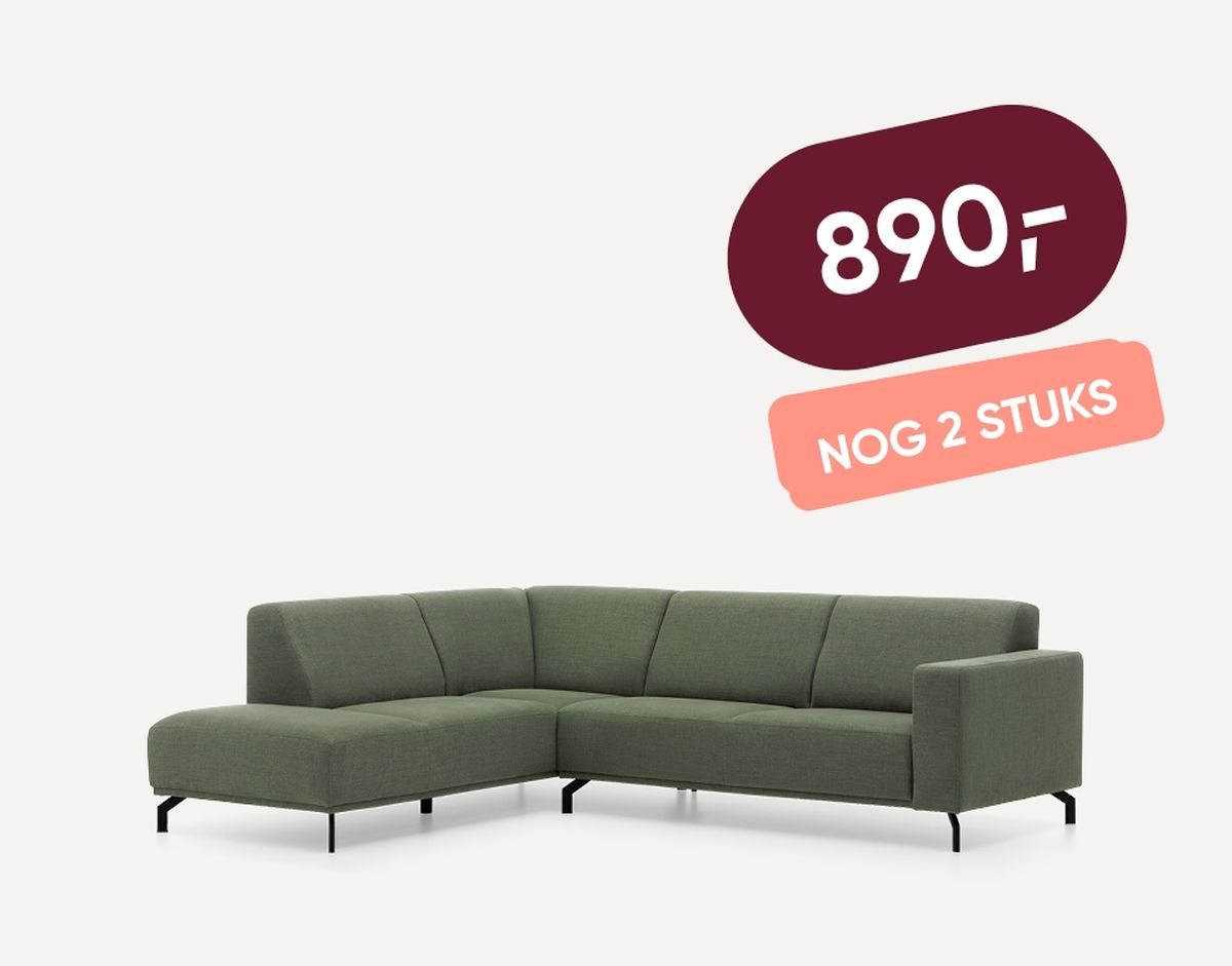 Green L-shaped sofa with simple black legs, priced at 890 with a note indicating only two pieces left.