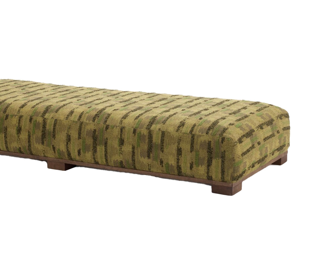A close-up image of the Magnus pouf, featuring a rectangular shape with a bold, patterned green fabric and wooden legs. The texture is soft with varying tones of green and brown in the woven design.