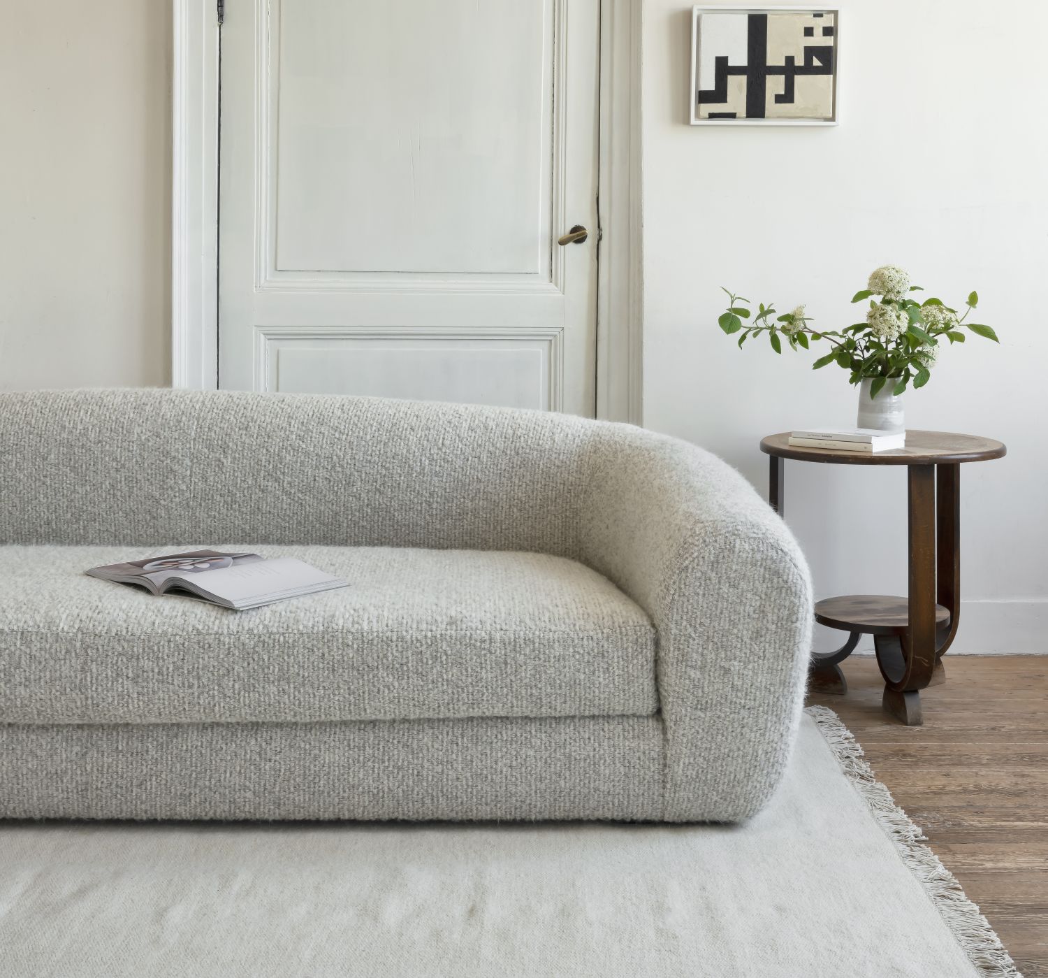 Sophia sofa by Collett & Victor – modern boucle upholstered designer sofa in neutral tones, styled in a contemporary living room.