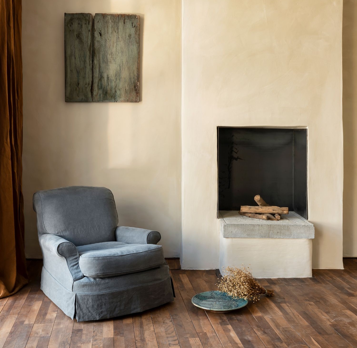 Clara One-Seater – upholstered armchair in dark grey slipcover by Collett & Victor, styled in cozy living room interior