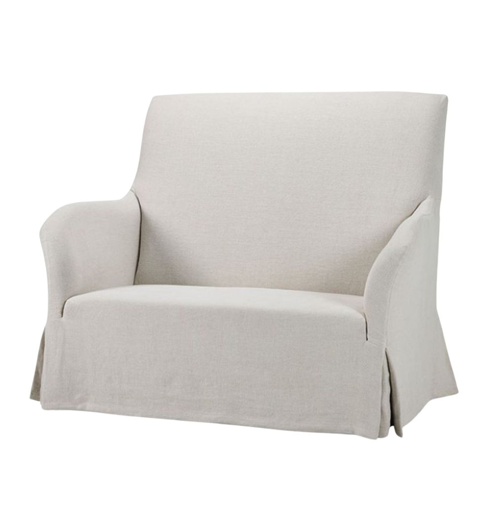 A minimalist Chouette loveseat with soft linen upholstery, featuring a simple and elegant design with a loose skirt at the base and curved armrests.