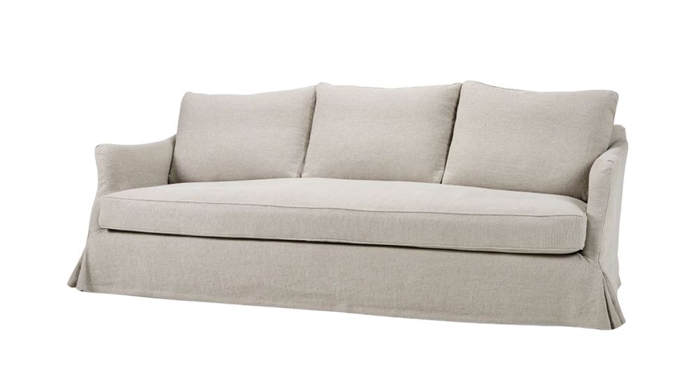 Beige Lucie sofa with three cushions, slim arms, and a skirted base.