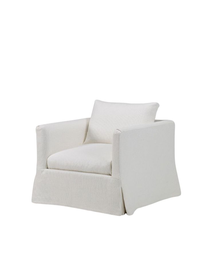 The Babette one-seater chair featuring a clean, minimalist design with a soft white fabric upholstery. The chair has square armrests and a contemporary, boxy shape with a slanted skirt at the base, adding a modern yet cozy look to the space. A single cushion rests on the seat.