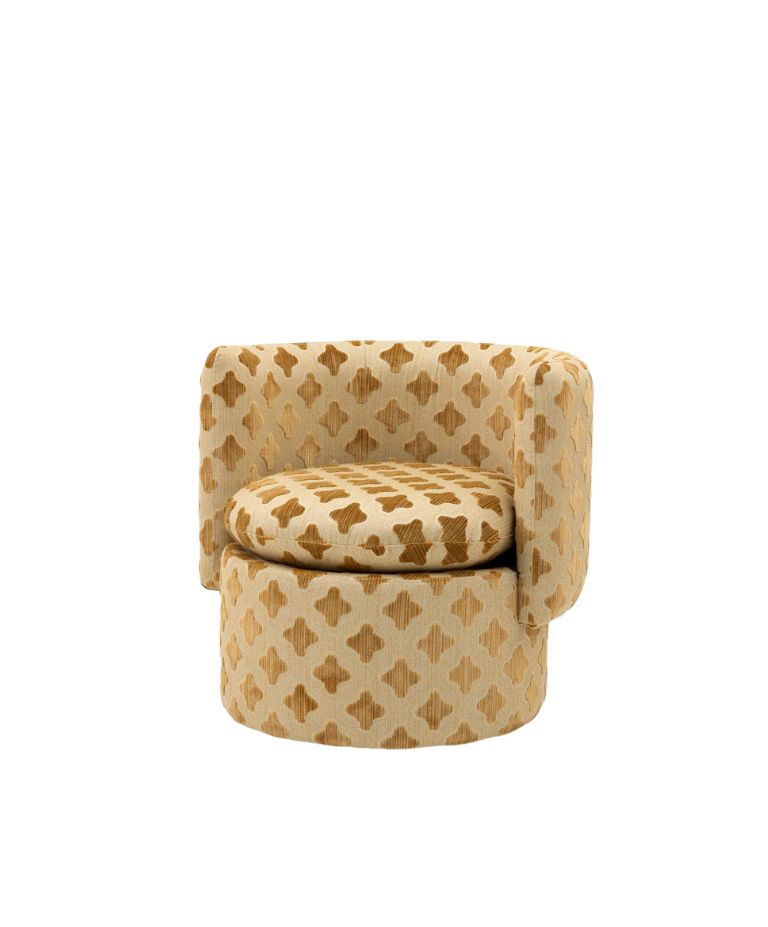 Patterned Carlton armchair with rounded back and circular seat.
