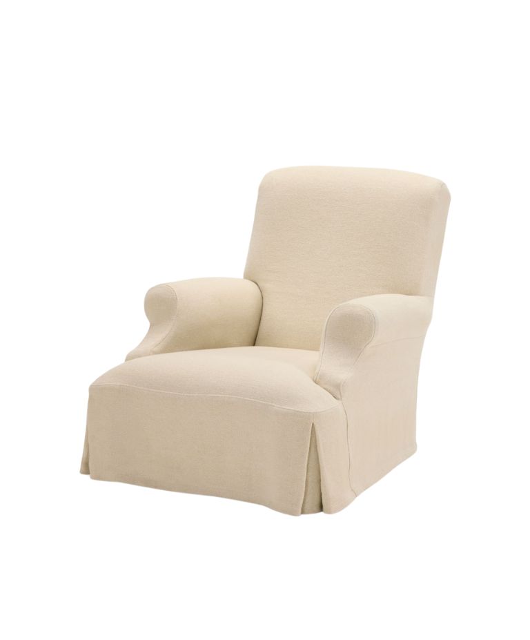 A soft, beige upholstered Aster one-seater armchair with rounded arms and a flowing skirt at the base. The chair has a clean, minimalistic look with smooth lines, creating a comfortable and inviting appearance.