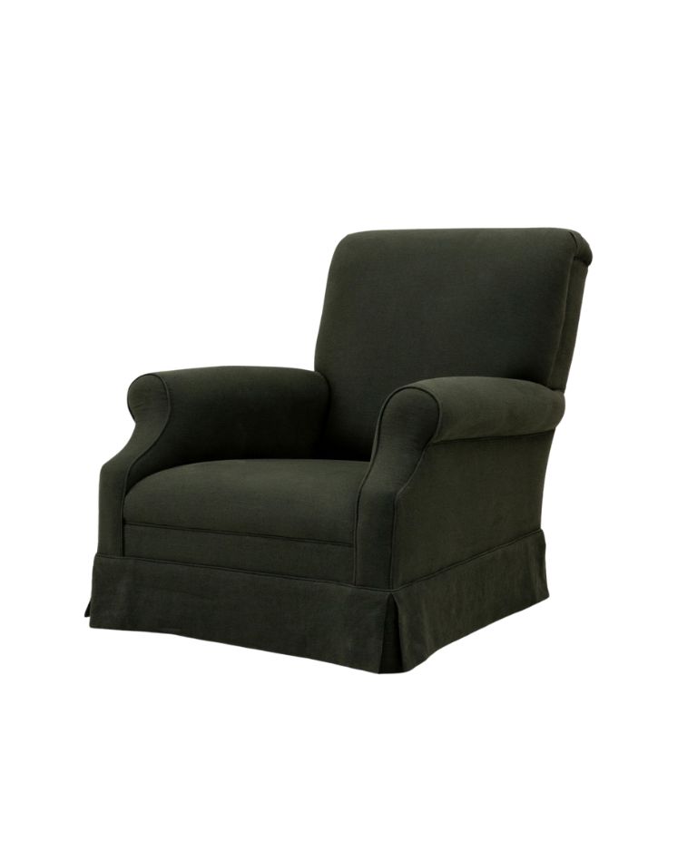 A dark green upholstered Amber one-seater armchair with a low, soft backrest, rounded arms, and a pleated skirt at the base. The chair has a classic, timeless design that looks cozy and inviting, with a simple, elegant appearance.