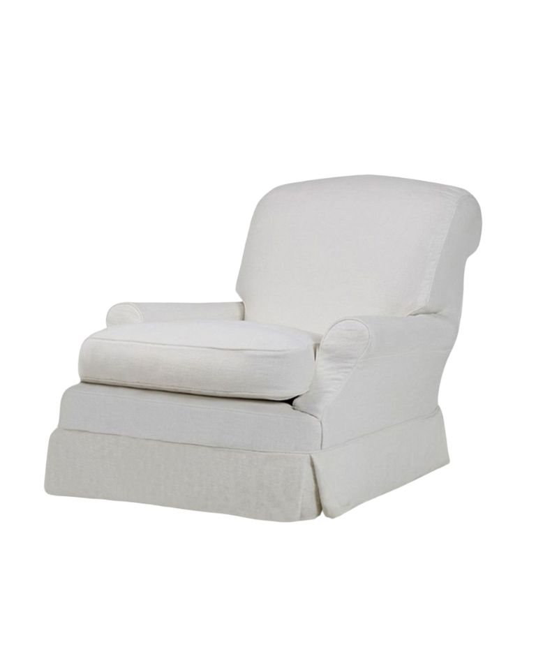 Clara armchair in off-white fabric, featuring a low curved back, rounded arms, and a skirted base with a loose seat cushion.