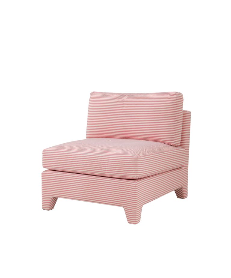 A modern, striped armchair with a soft pink and white pattern. The chair features a low, wide seat and a rectangular backrest for a relaxed, minimalist look. The frame has clean lines with subtle, angular legs, giving it a contemporary feel.