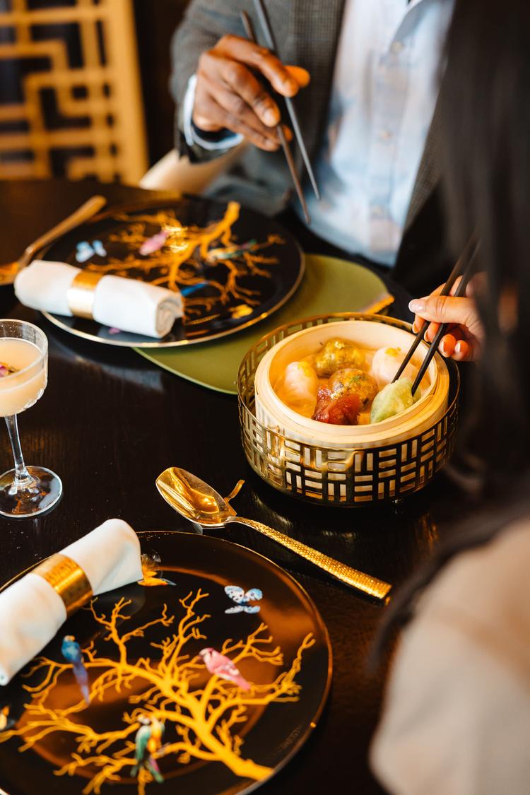 Close up of decorate table with couple eating award-winning Dim Sum at JM Oriental