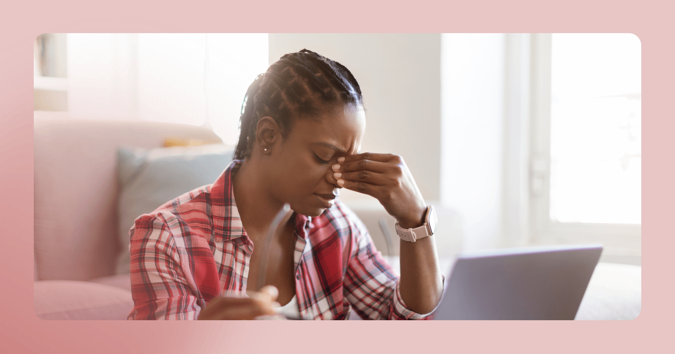 woman with a headache feeling overwhelmed