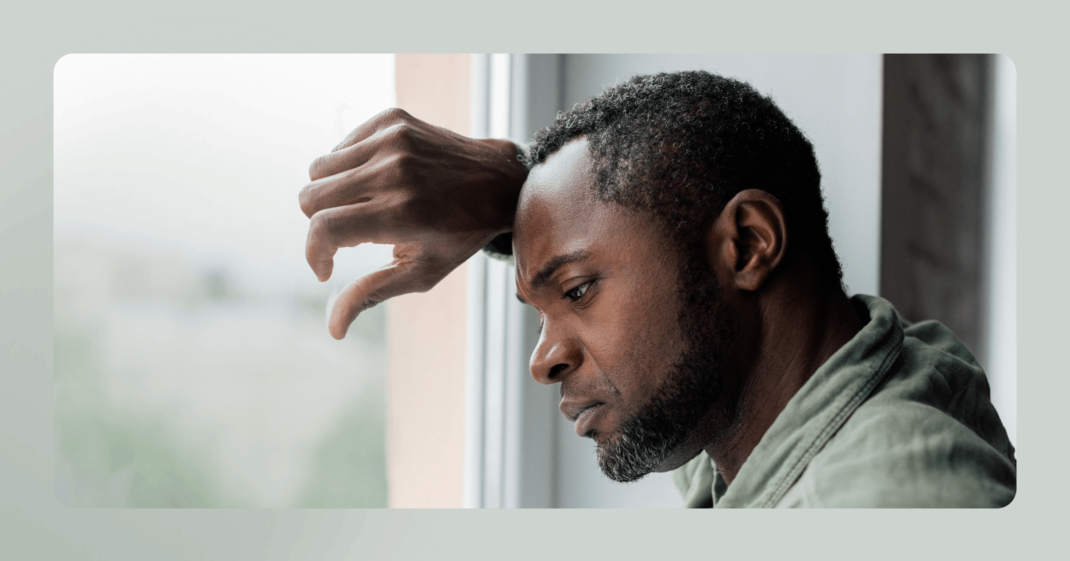 man experiencing a somatic flashback trying to stay grounded in the present moment