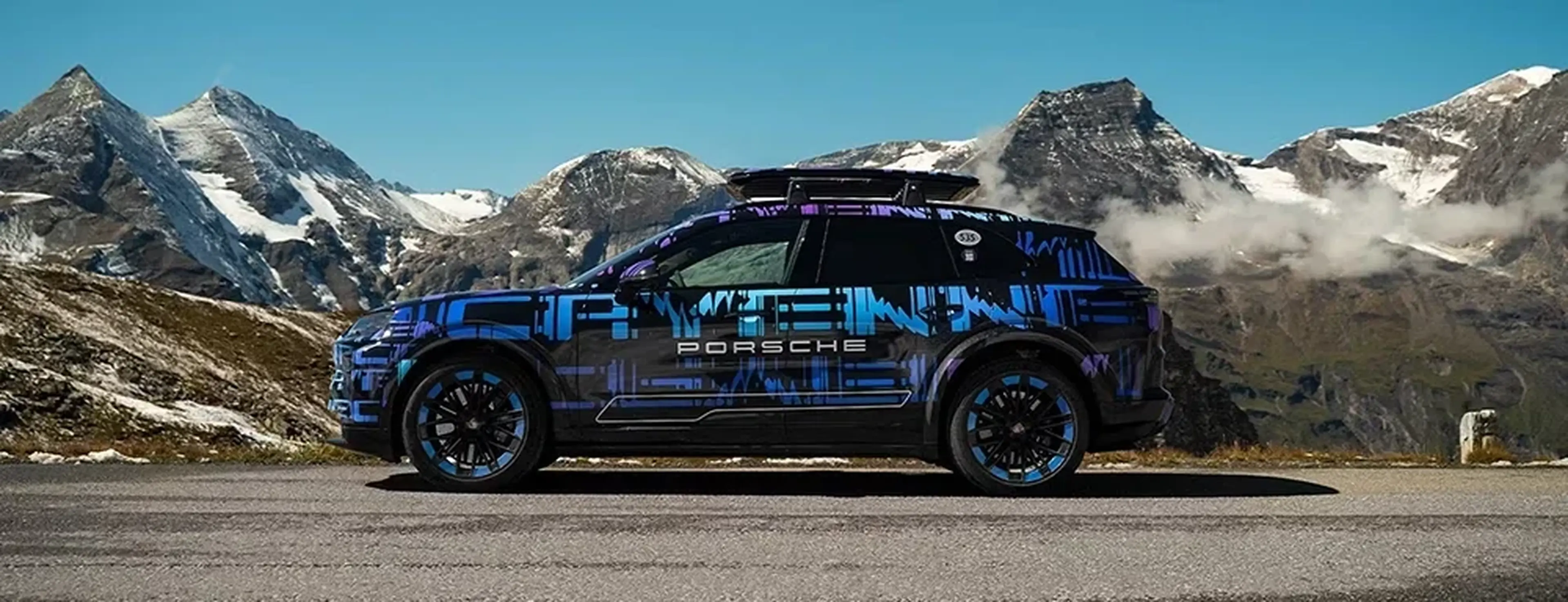 Camouflaged Porsche Cayenne Electric prototype in the mountains