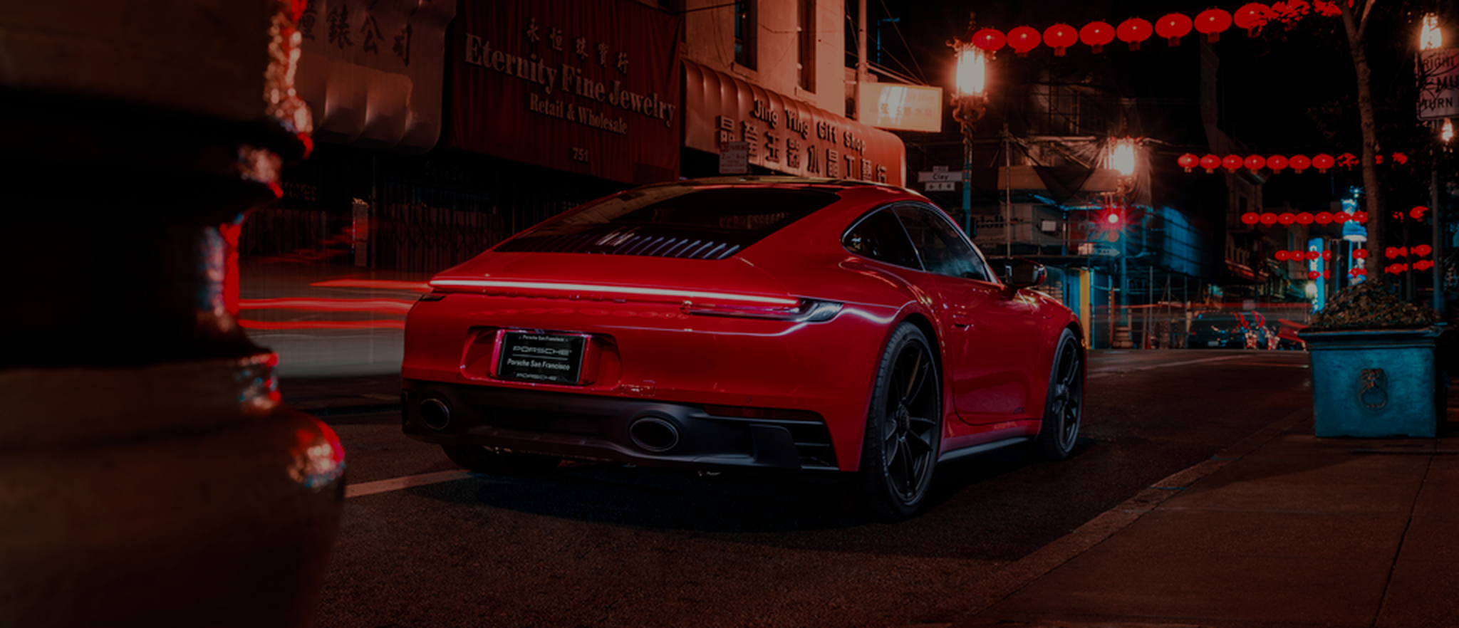 Red Porsche 911 on a San Francisco street at night