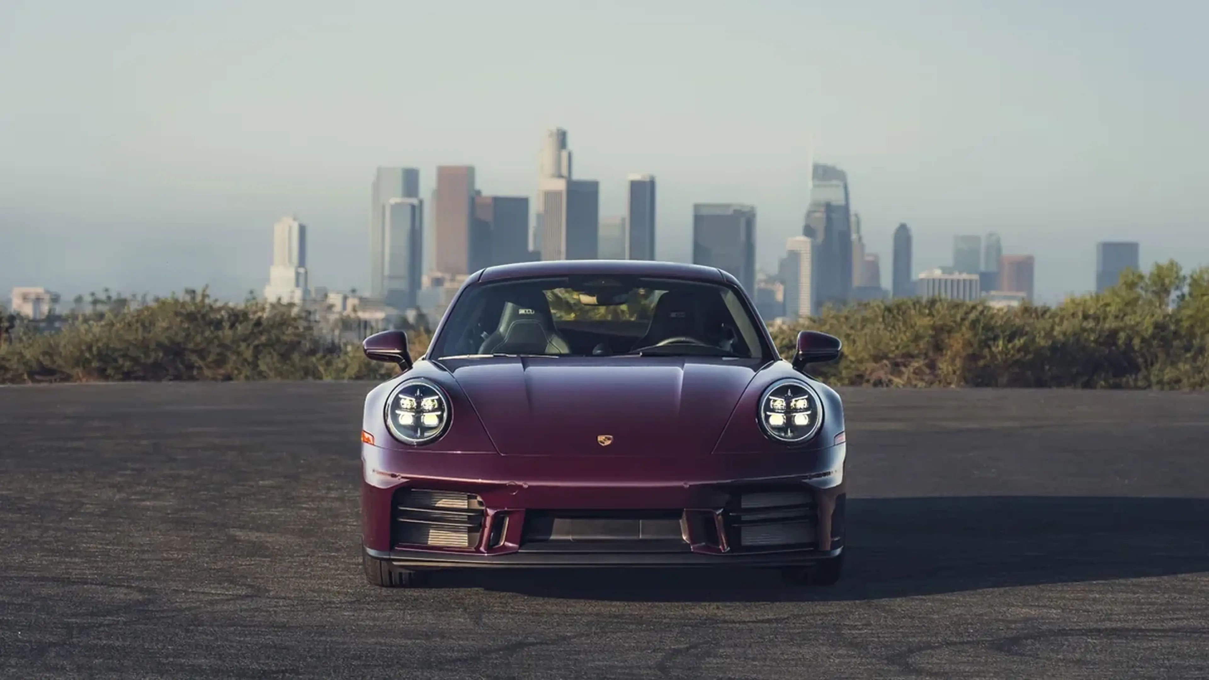 2027 Porsche 911 Carrera S front three-quarter view with a skyline