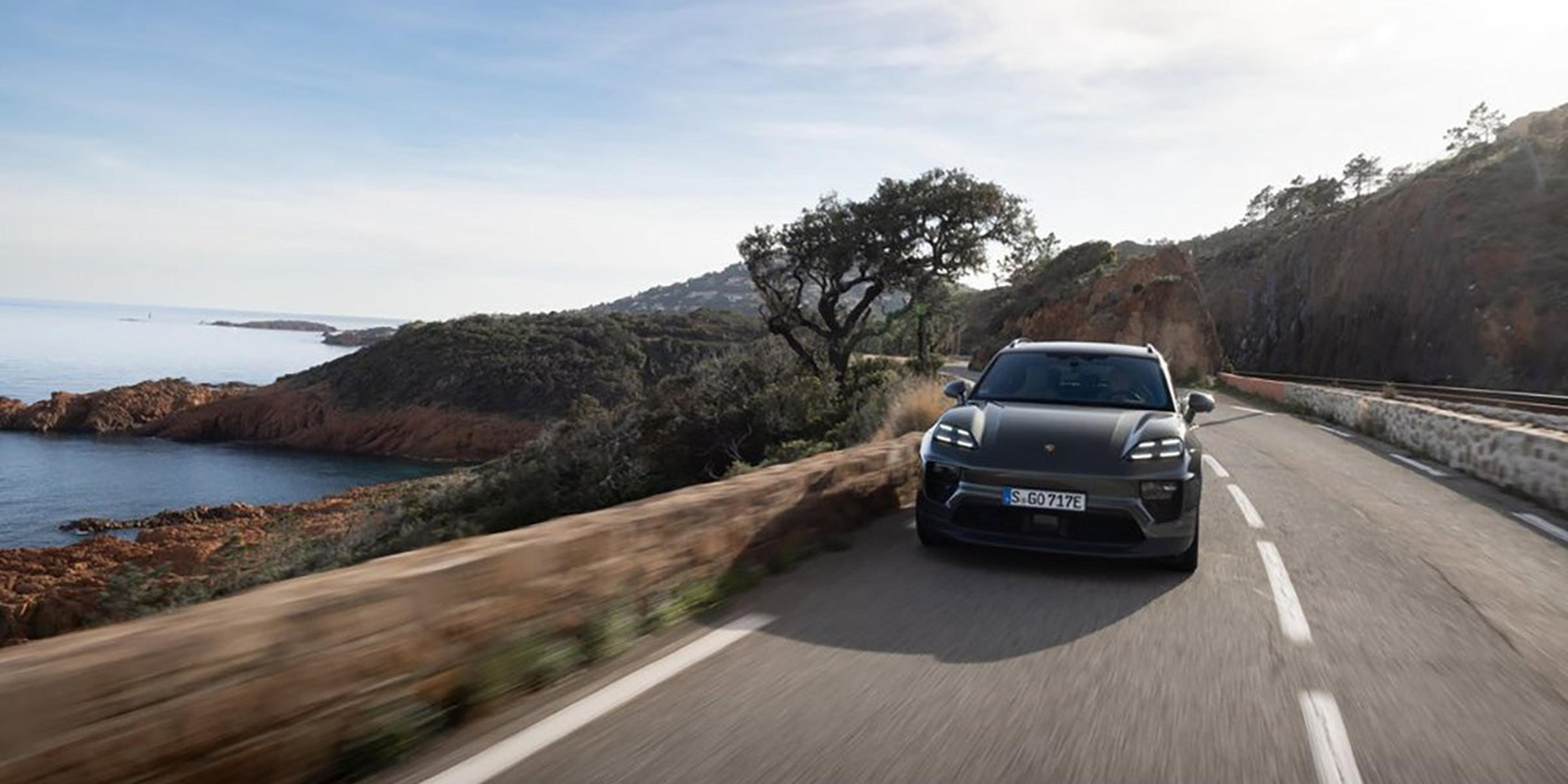 2025 Porsche Macan 4 Electric on a coastal road