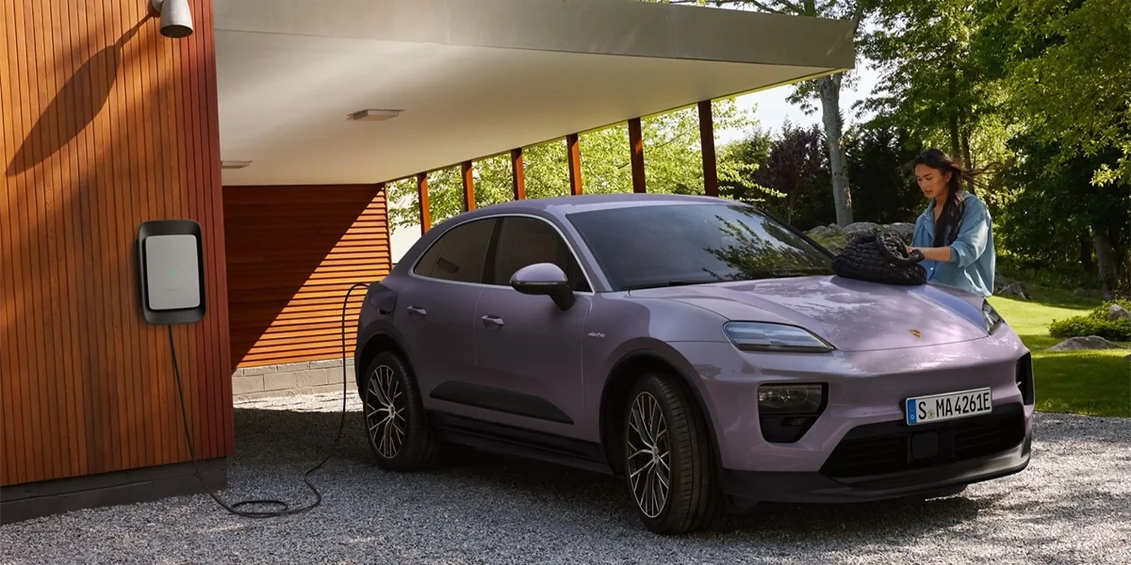 2026 Porsche Macan Electric 4 charging at home wallbox station in Lincolnwood, IL