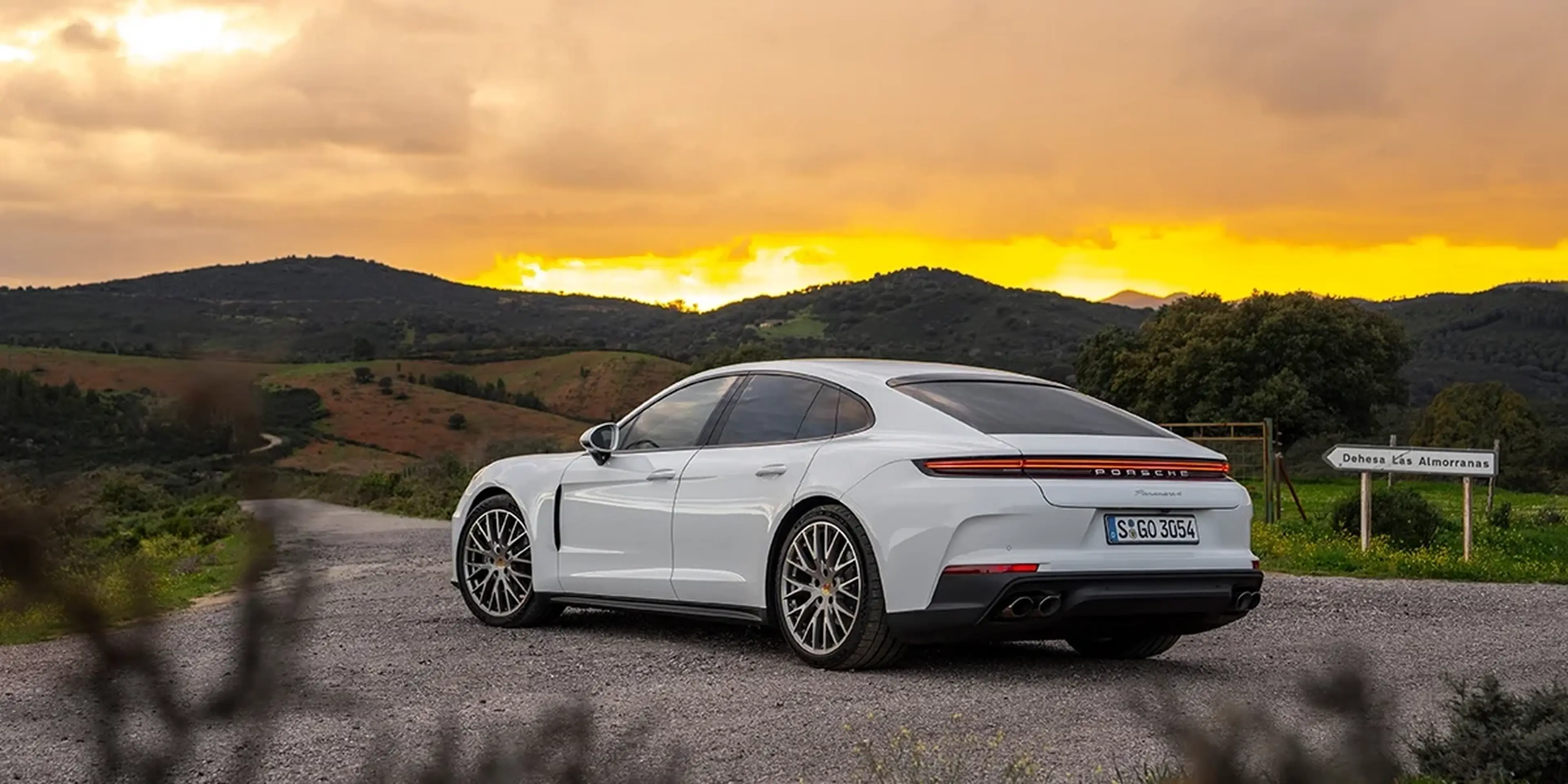 White 2025 Porsche Panamera at sunset