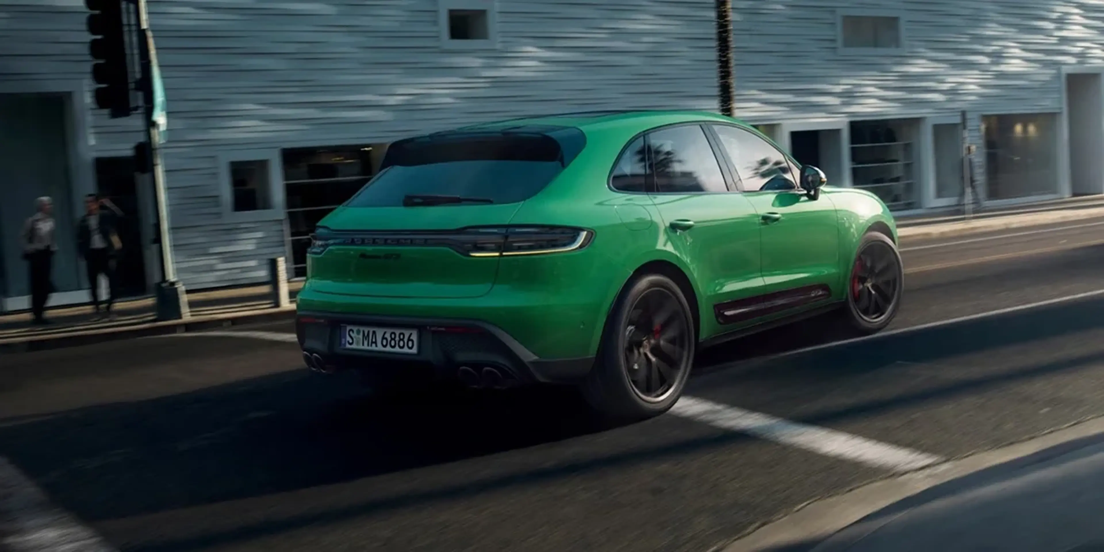 Porsche Macan demonstrating all-wheel-drive capability, emphasizing grip and stability for varied road conditions