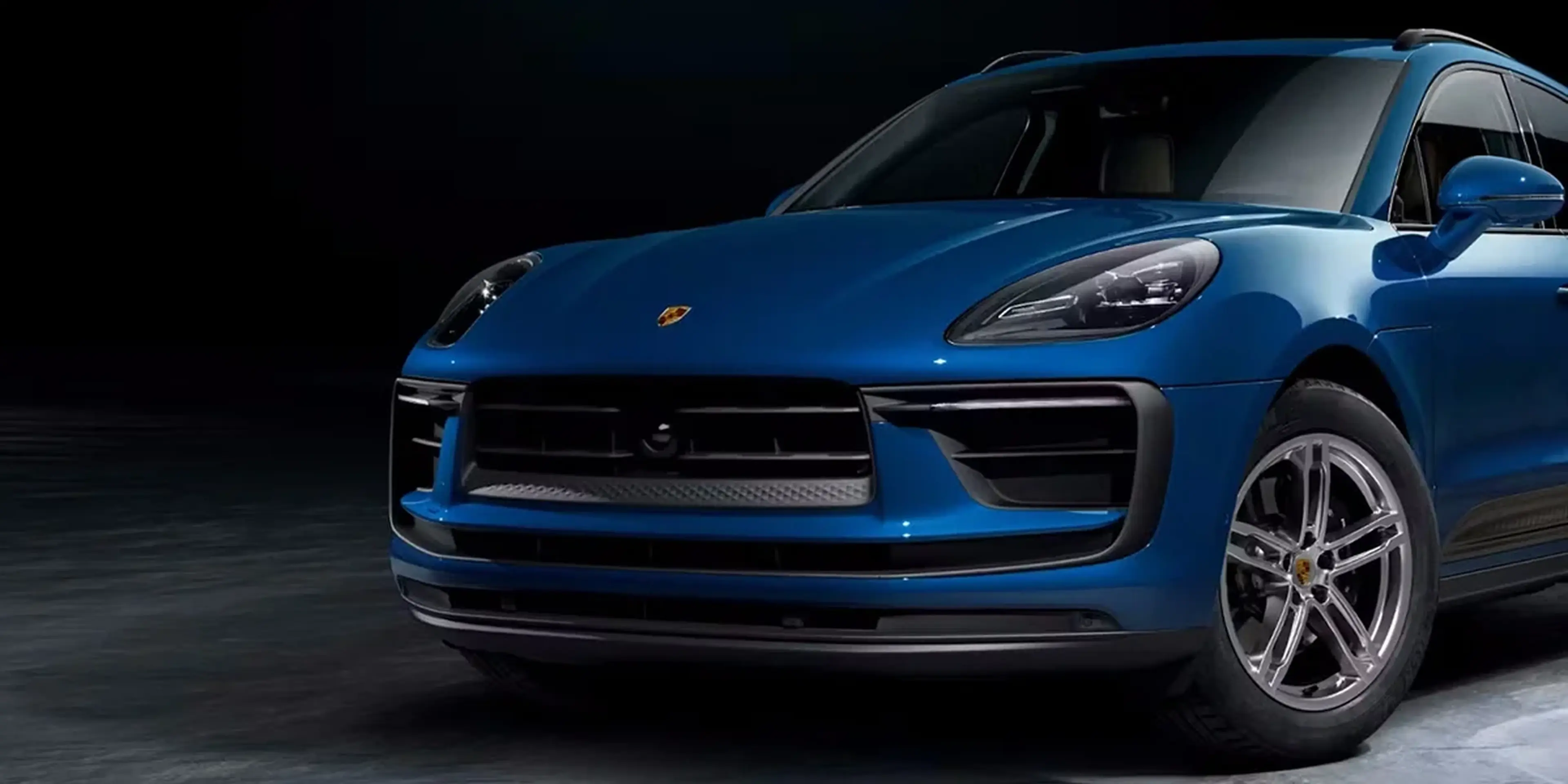 Blue Porsche Macan GTS SUV emphasizing high-revving V6 engine performance and dynamic stance.
