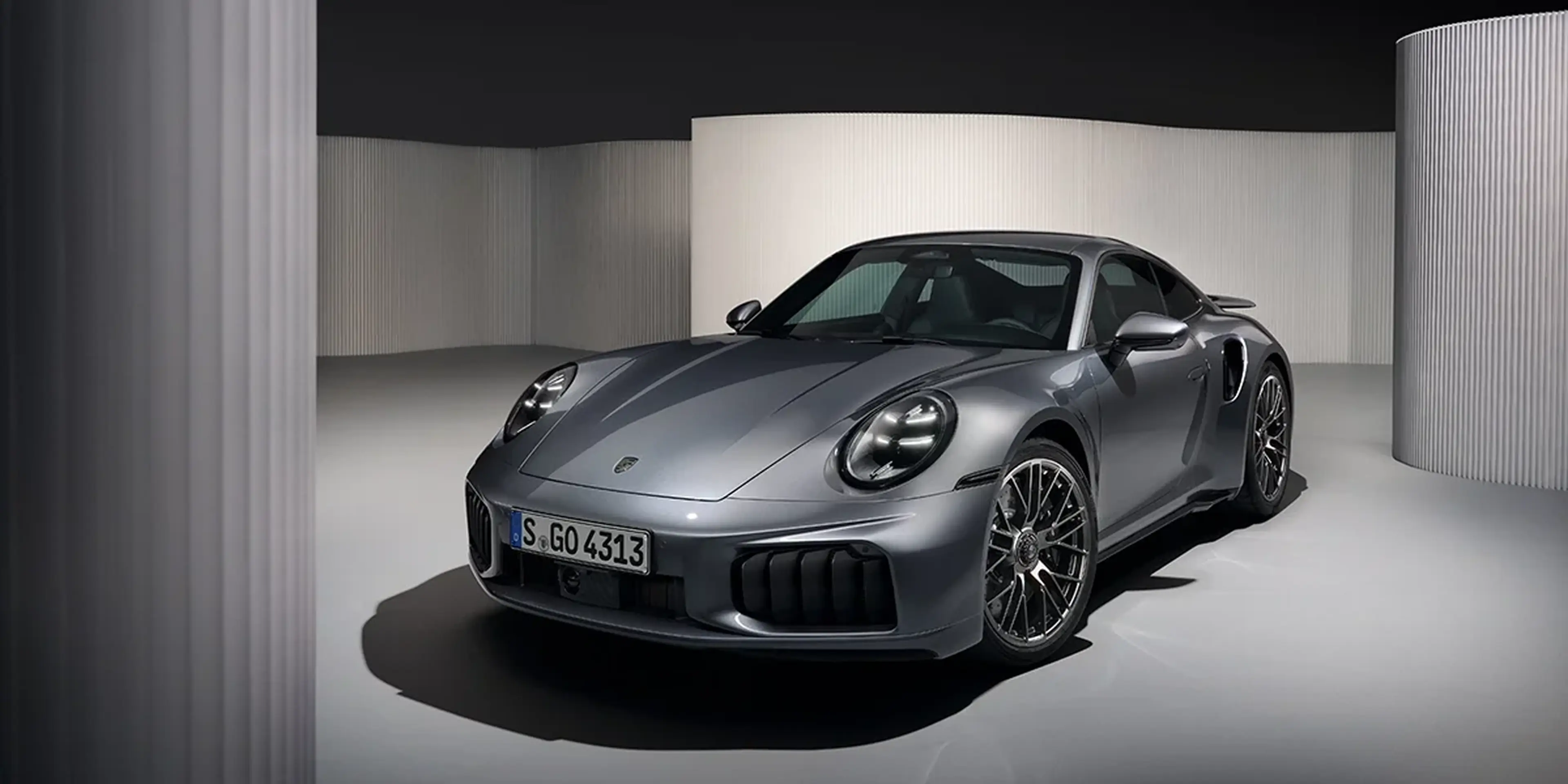 Gray 2026 Porsche 911 Turbo S front three-quarter view