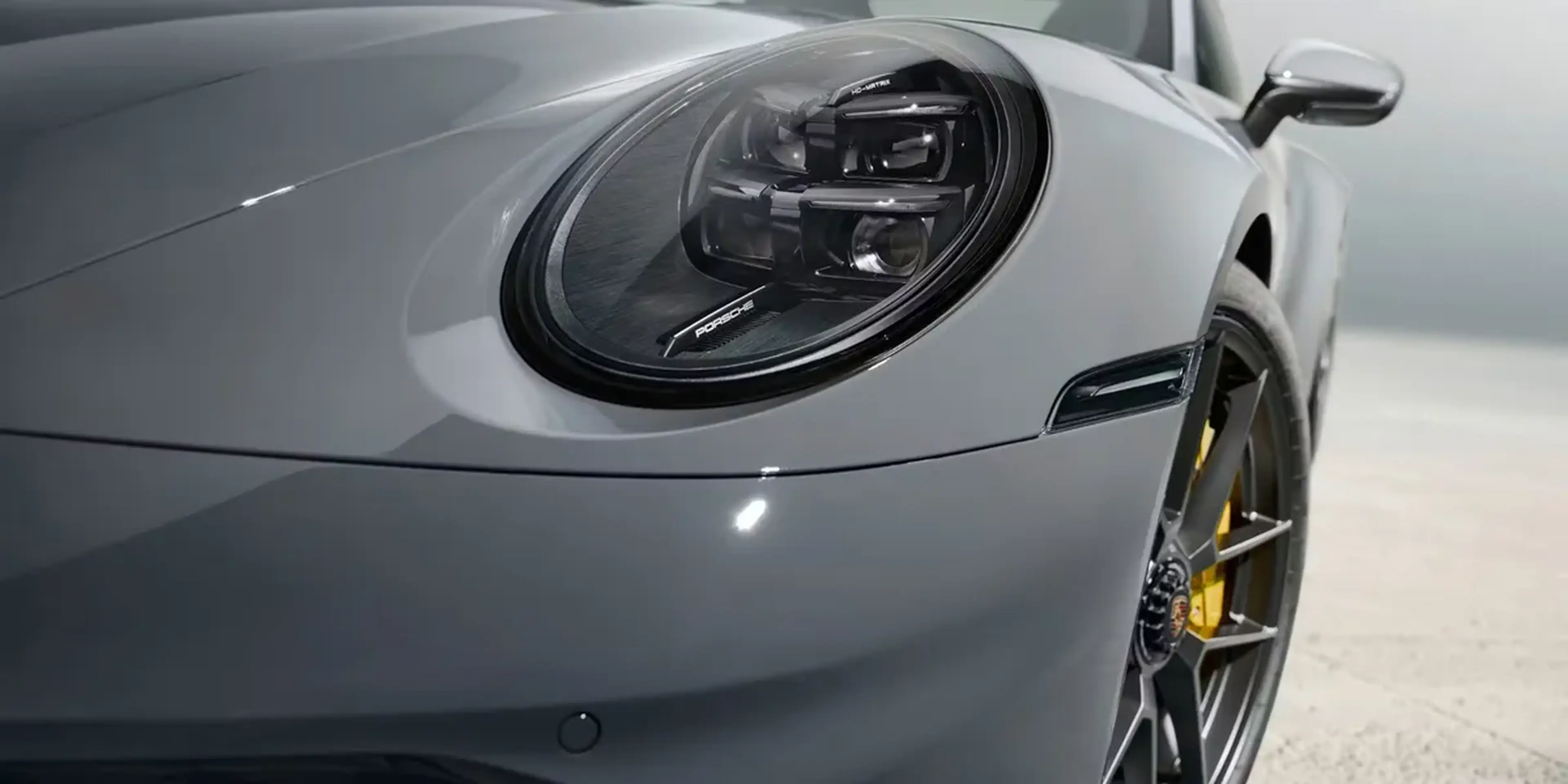 Rear diffuser and dual sport exhaust system of the 2026 Porsche 911 Carrera GTS.