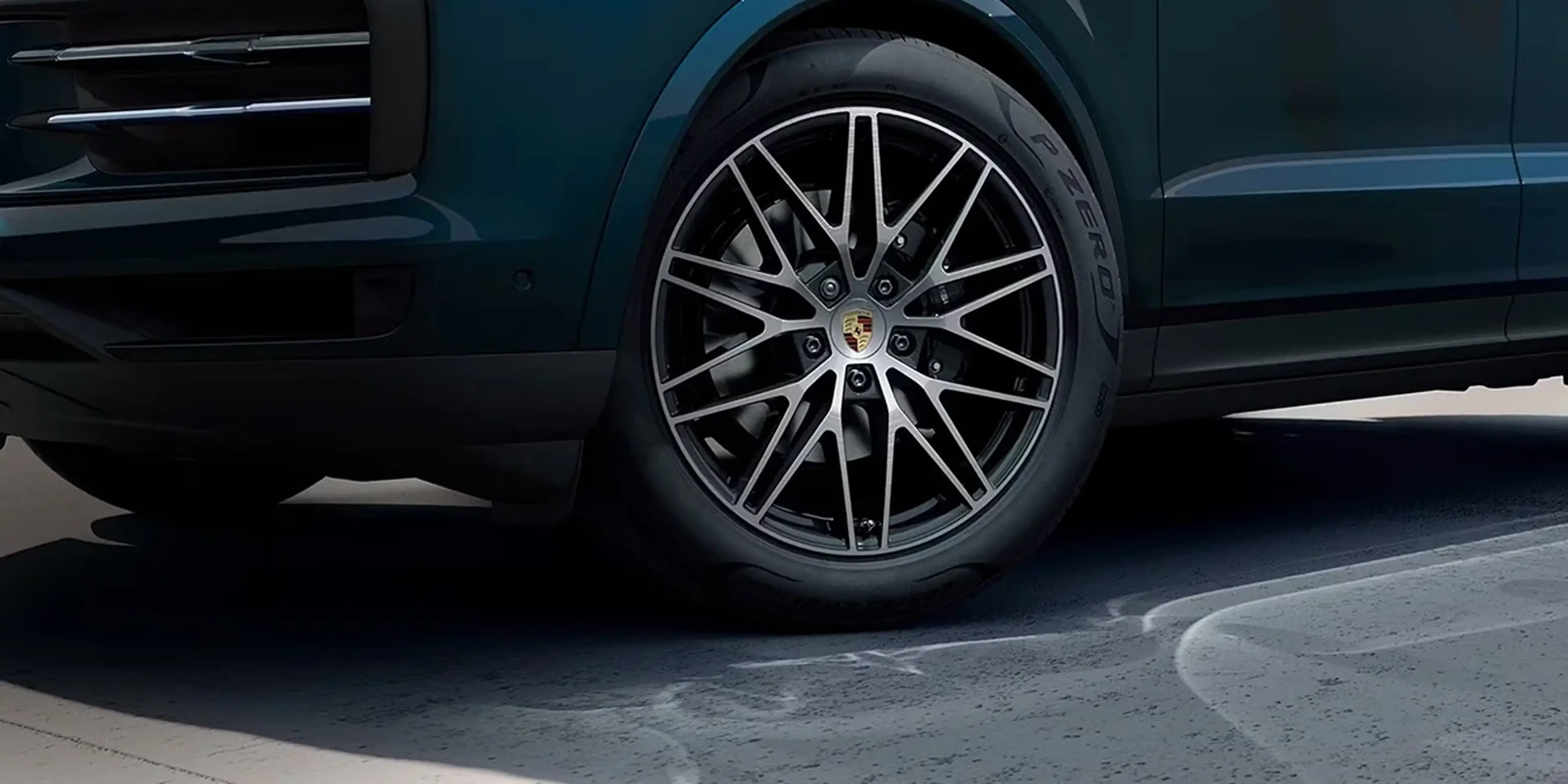Close-up of the front wheel and suspension of the 2026 Porsche Cayenne.