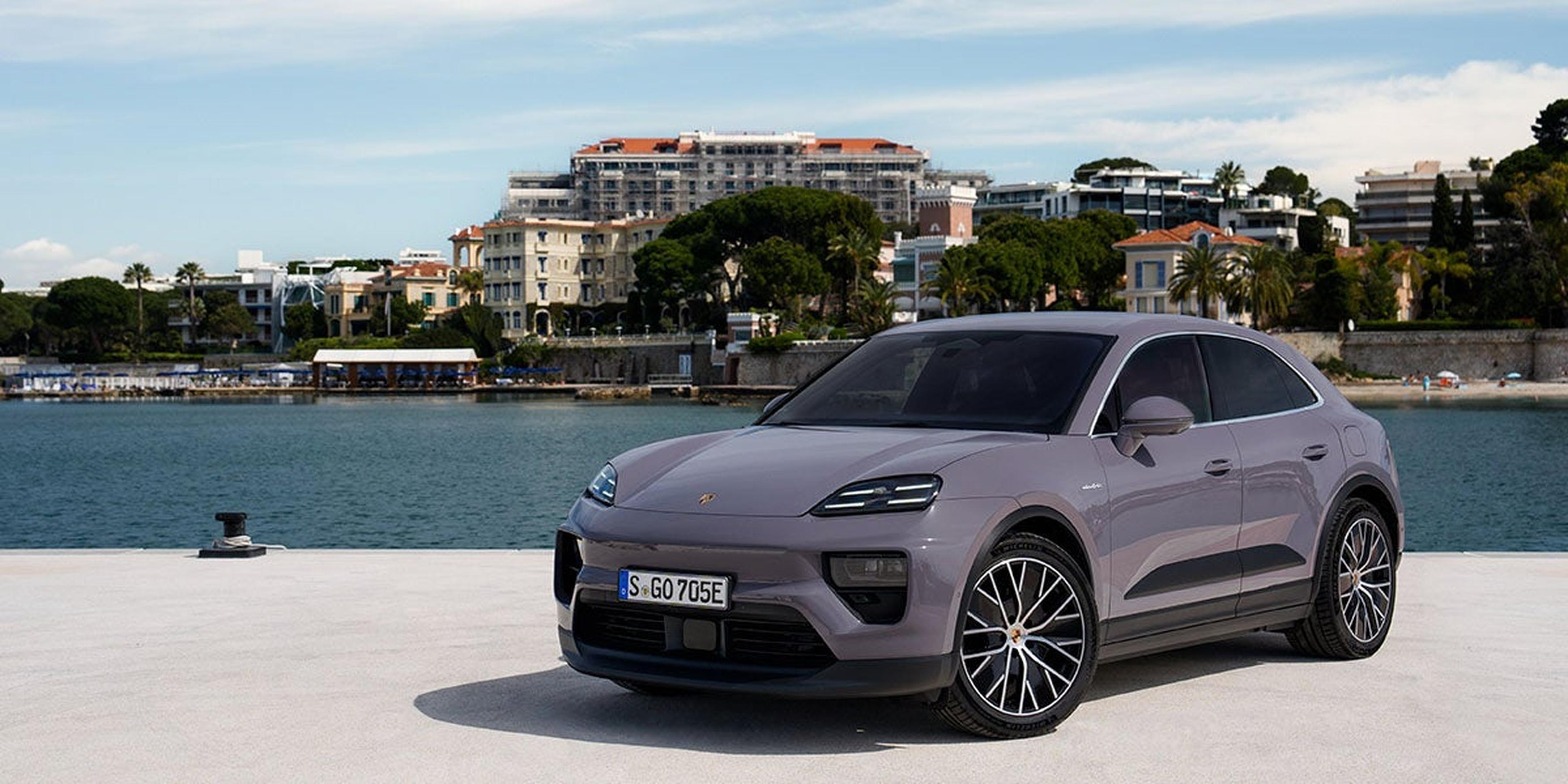 2025 Porsche Macan 4 Electric parked by a marina