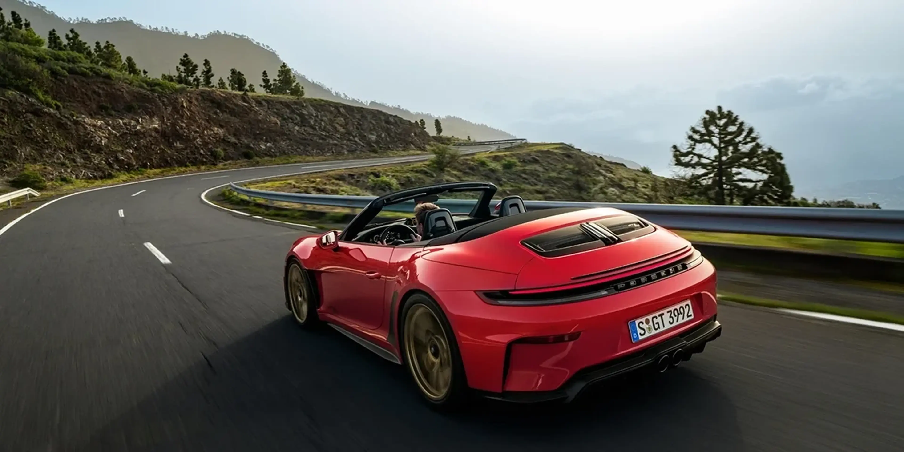 Red 2027 Porsche 911 GT3 S/C Cabriolet with the top down