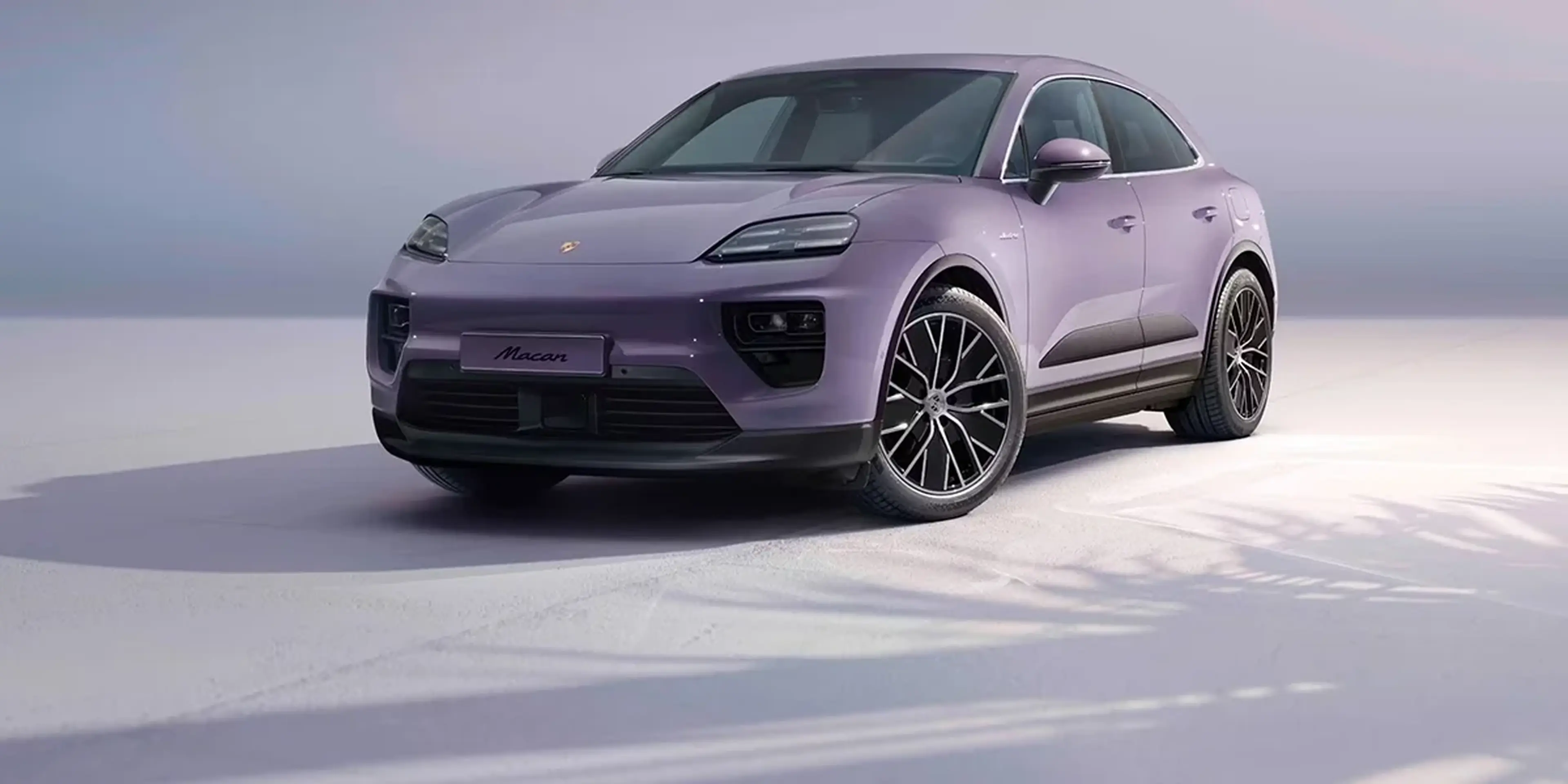 Rear view of Porsche Macan T highlighting Porsche logo and taillight bar