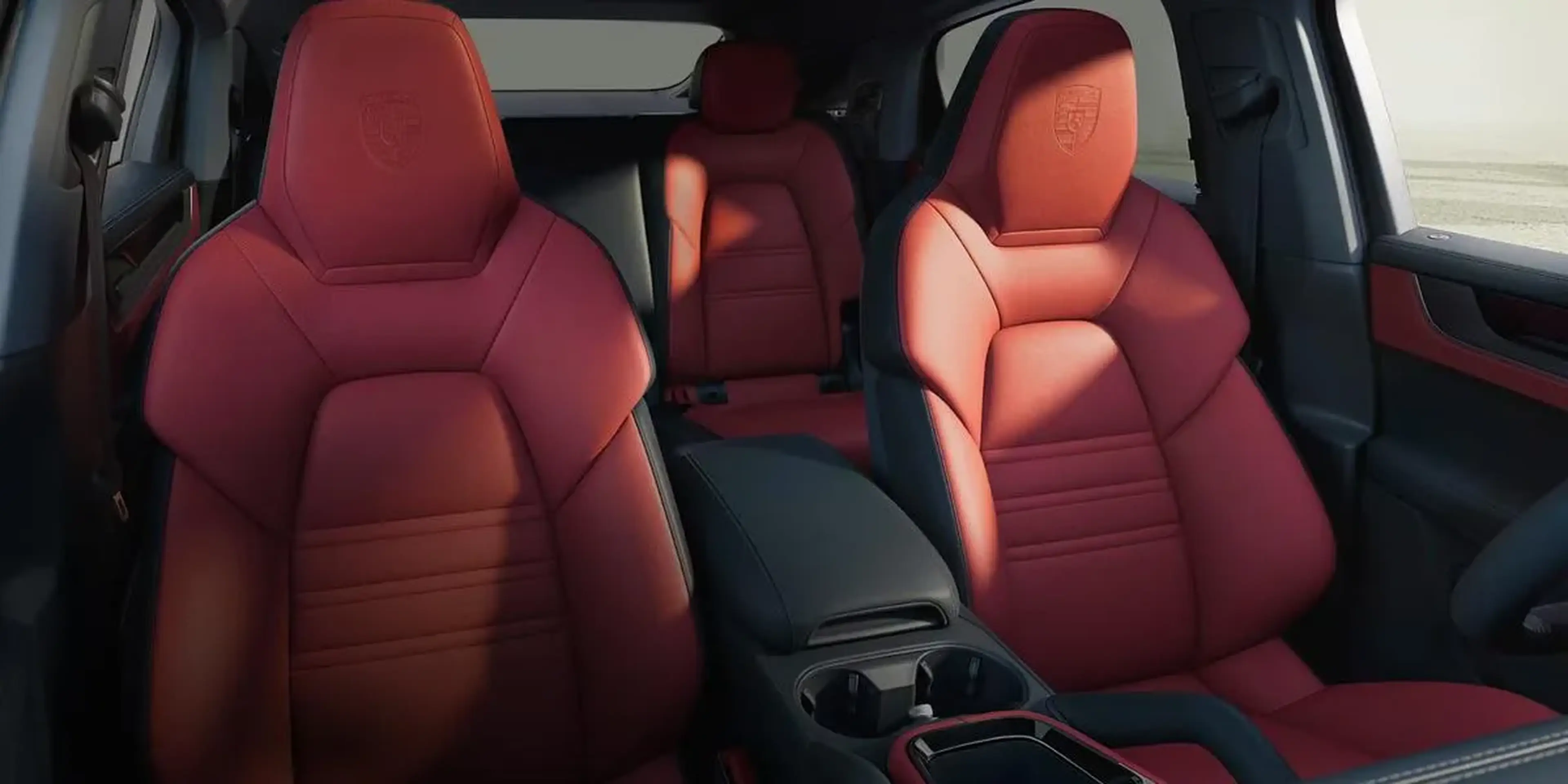 Interior of 2026 Porsche Cayenne showcasing red leather sport seats